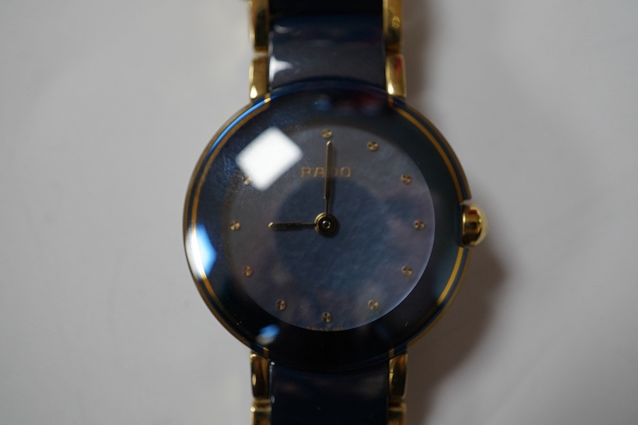 A lady's modern titanium and ceramic Rado Diastar quartz wrist watch, case diameter 23mm, with case and spare bezel and hands. Condition - fair to good